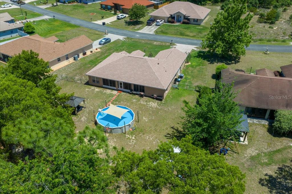 5321 Southwest 115th Loop Ocala, FL 34476 - Photo 5 of 49 an aerial view of a house with yard swimming pool and outdoor seating