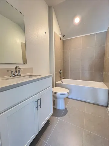 a bathroom with a sink a toilet and a bathtub