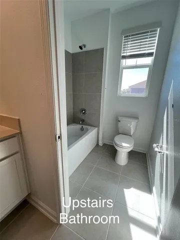 a bathroom with a toilet and a sink