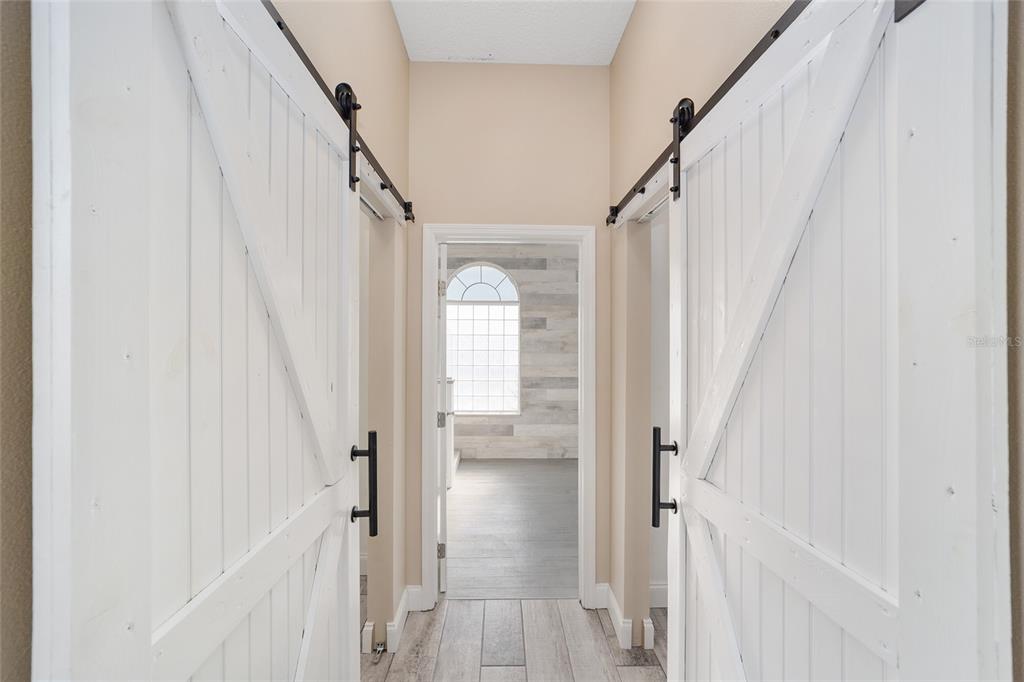 5565 Northwest 26th Lane Ocala, FL 34482 - Photo 24 of 59 a view of a hallway with a white walls and stairs