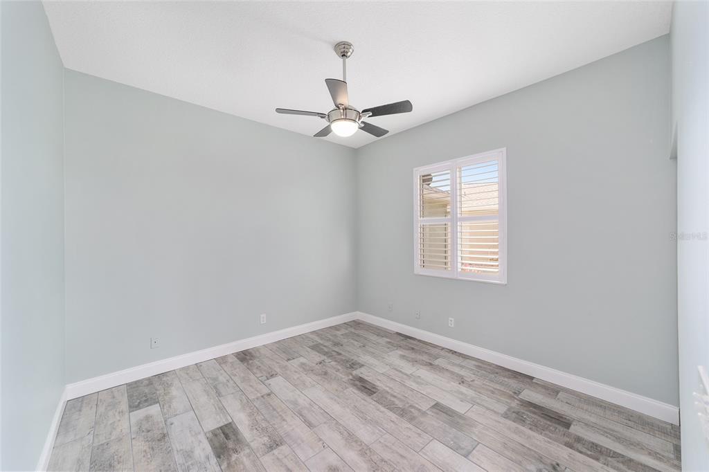 5565 Northwest 26th Lane Ocala, FL 34482 - Photo 29 of 59 an empty room with a window and a fan