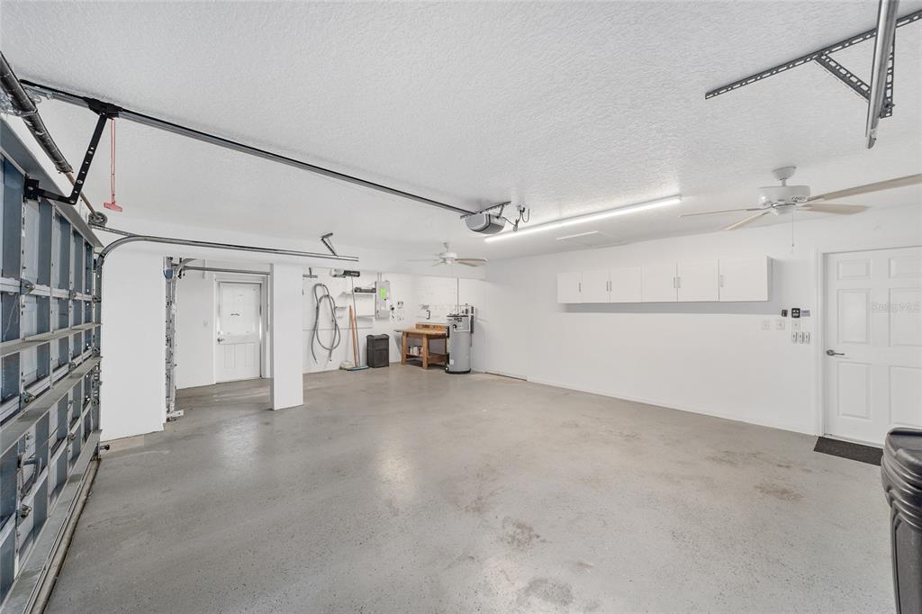 5565 Northwest 26th Lane Ocala, FL 34482 - Photo 35 of 59 an empty room with chandelier fan and windows