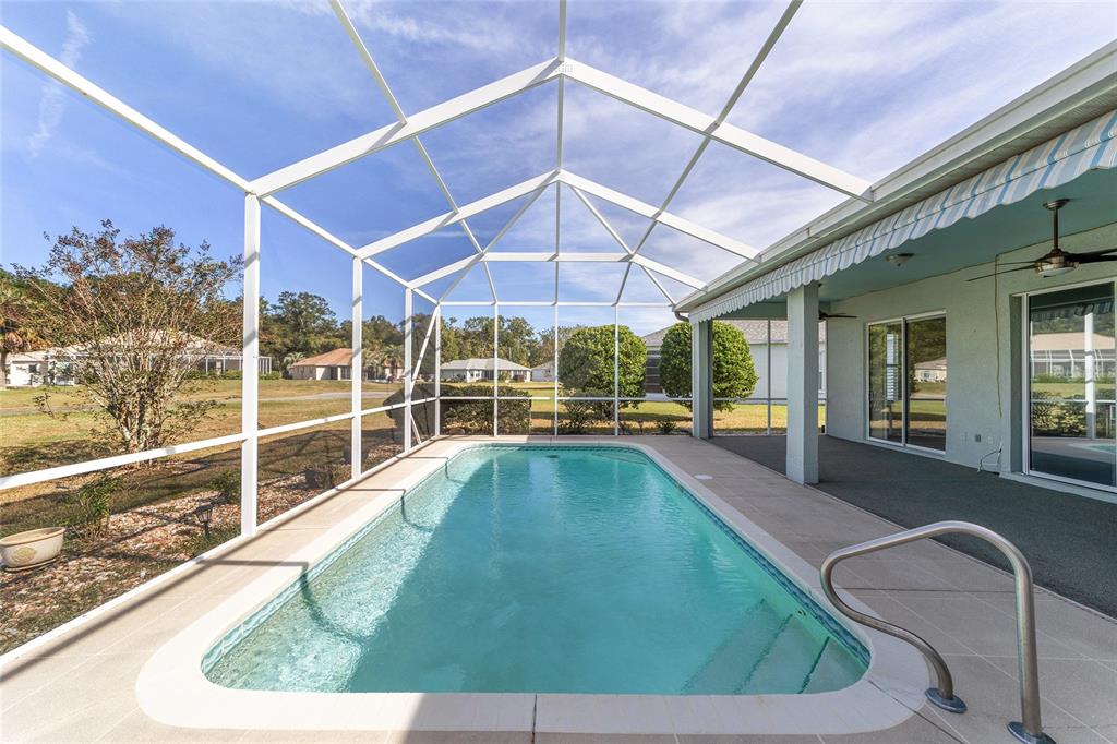 5565 Northwest 26th Lane Ocala, FL 34482 - Photo 40 of 59 a swimming pool with outdoor seating