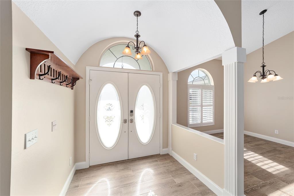 5565 Northwest 26th Lane Ocala, FL 34482 - Photo 6 of 59 a front view of a house with garden