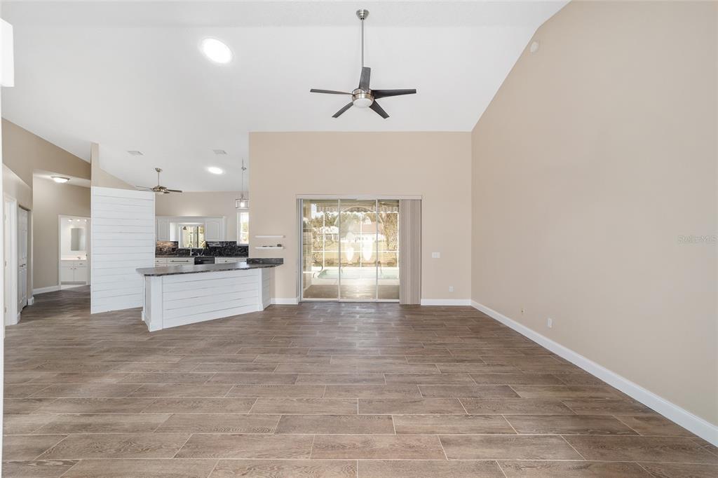 5565 Northwest 26th Lane Ocala, FL 34482 - Photo 7 of 59 a view of kitchen with refrigerator and window