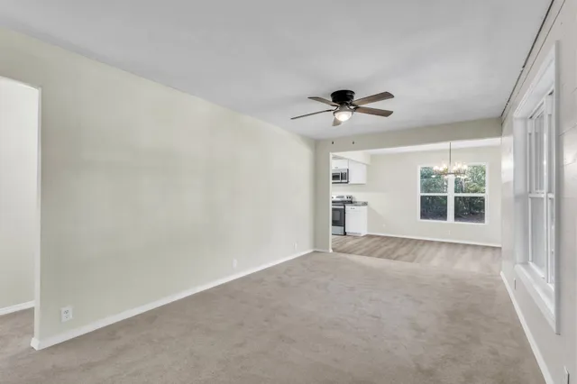 a view of an empty room with a window