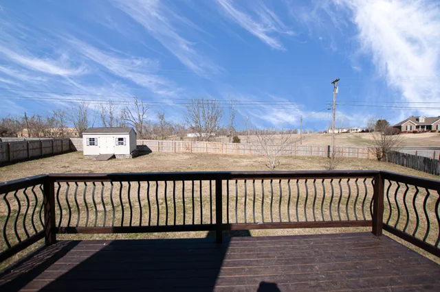 a view of a balcony with wooden floor