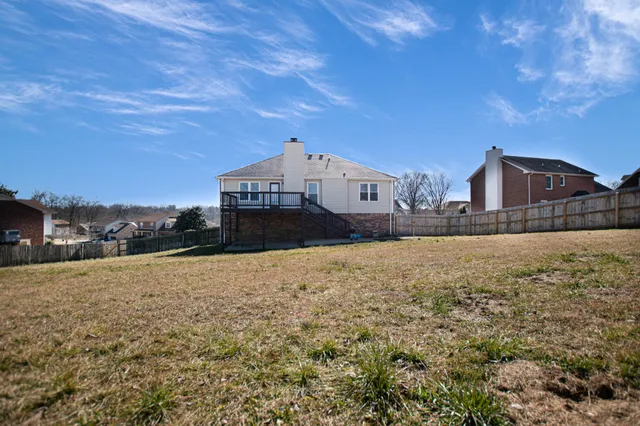 a view of large house with a yard