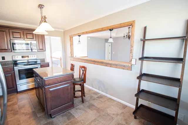 a view of a room with furniture and windows