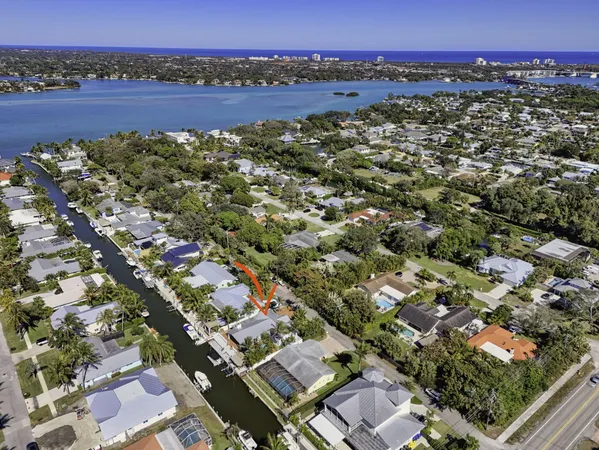 a kitchen with stainless steel appliances kitchen island granite countertop a sink and cabinets