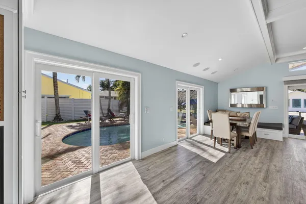 a view of a bedroom with furniture and windows