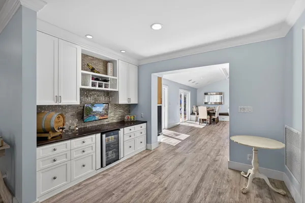 a view of a room with gym equipment and windows