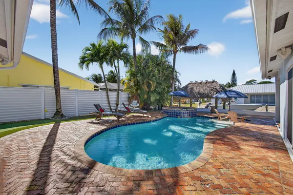 a view of living room kitchen with furniture and a fireplace