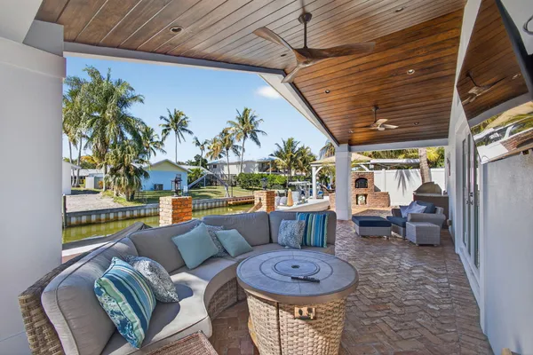 swimming pool view with a seating space