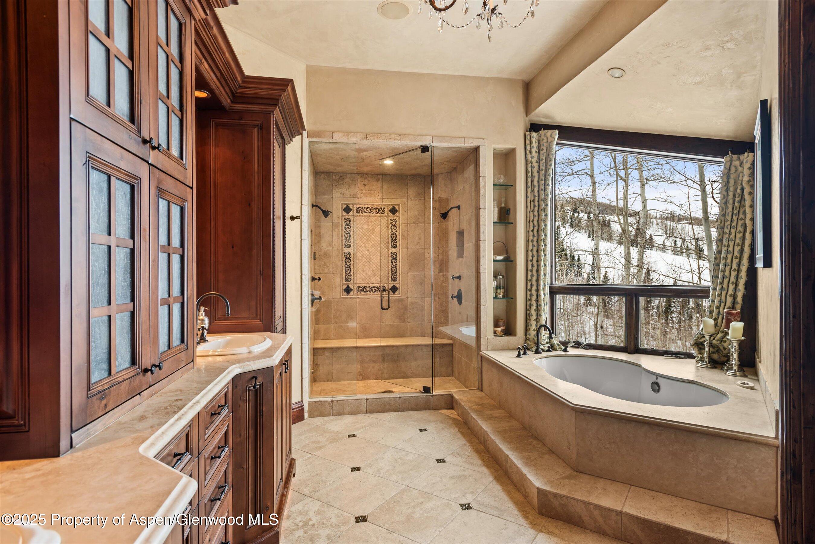 1777 Wood Road Snowmass Village, CO 81615 - Photo 11 of 27 a bathroom with a tub a sink a mirror and a shower