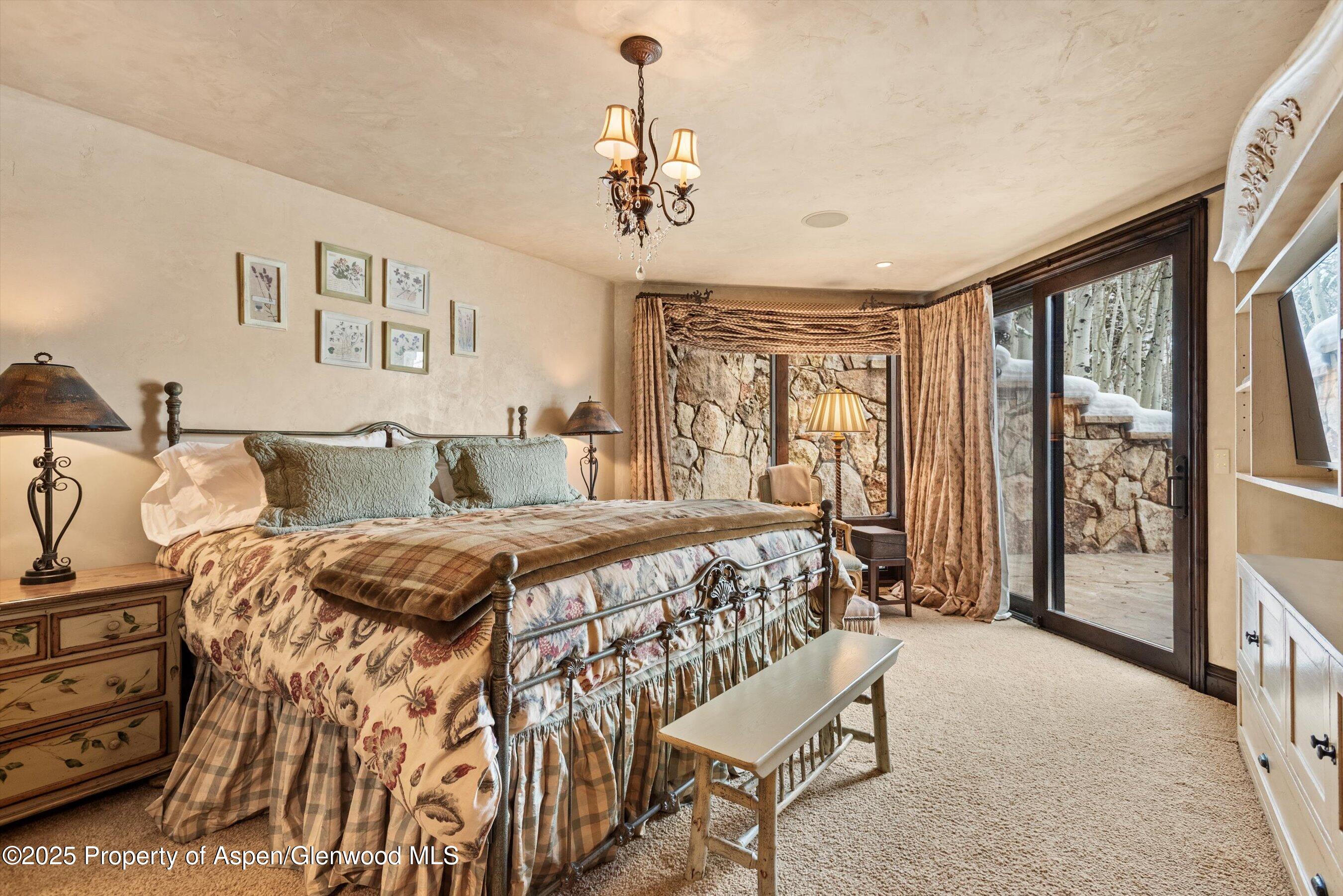 1777 Wood Road Snowmass Village, CO 81615 - Photo 14 of 27 a bed sitting in a bedroom next to a window