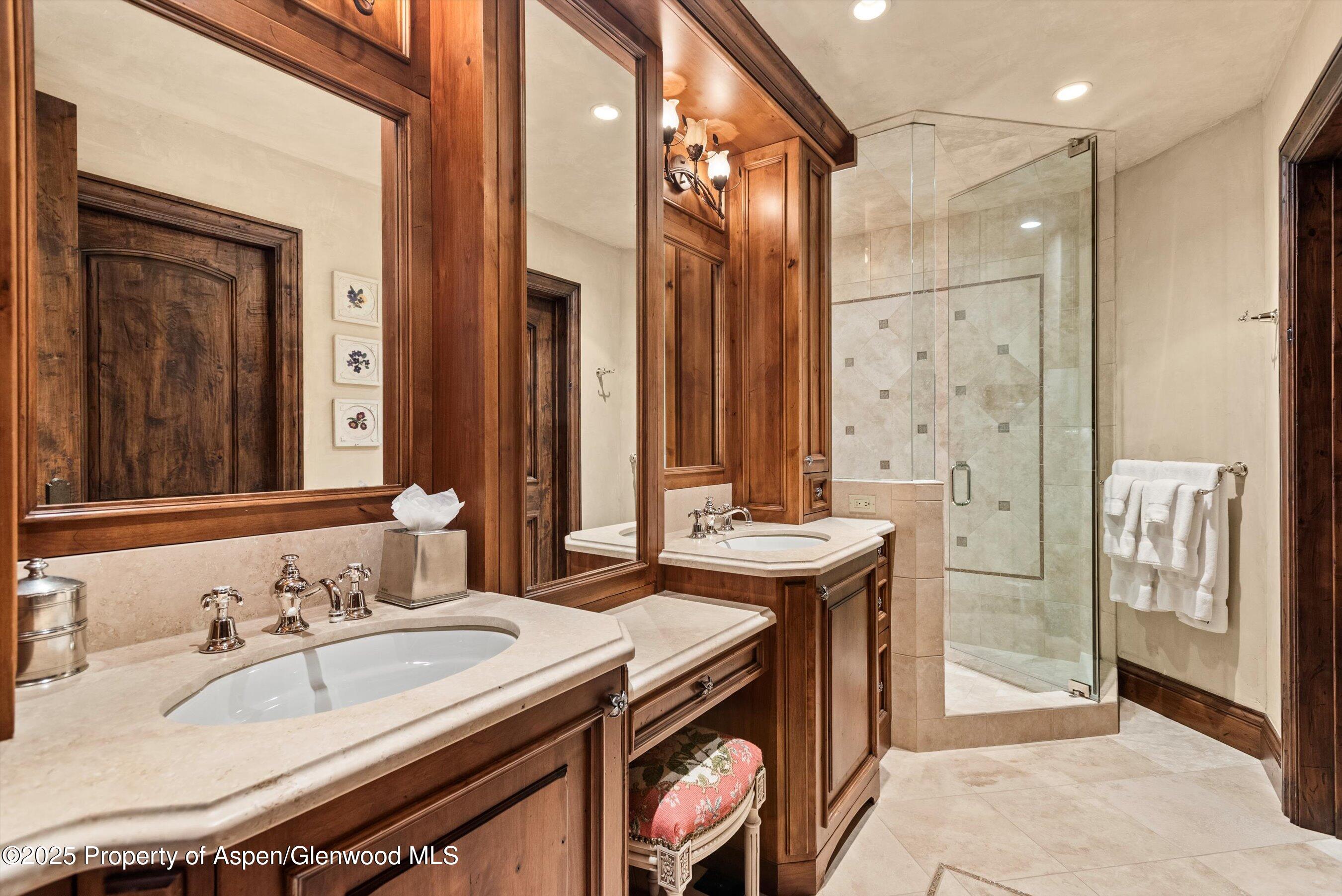 1777 Wood Road Snowmass Village, CO 81615 - Photo 15 of 27 a bathroom with a sink double vanity and a mirror