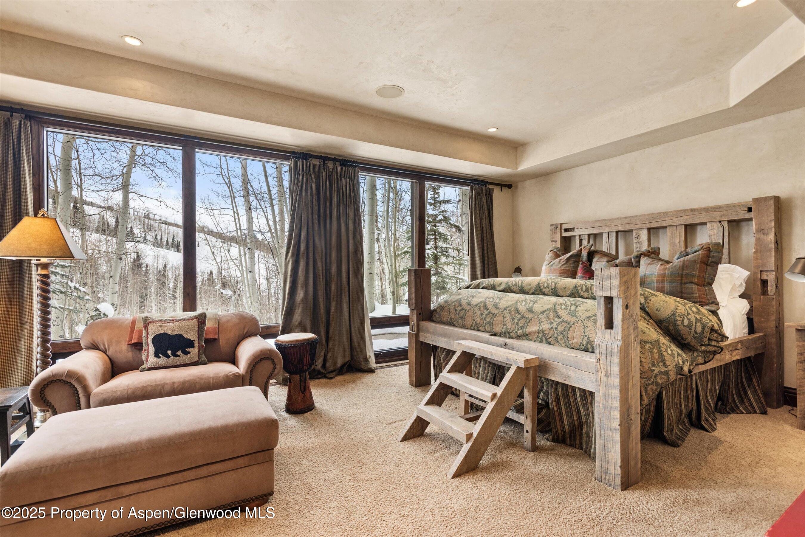1777 Wood Road Snowmass Village, CO 81615 - Photo 16 of 27 a bedroom with furniture and a large window