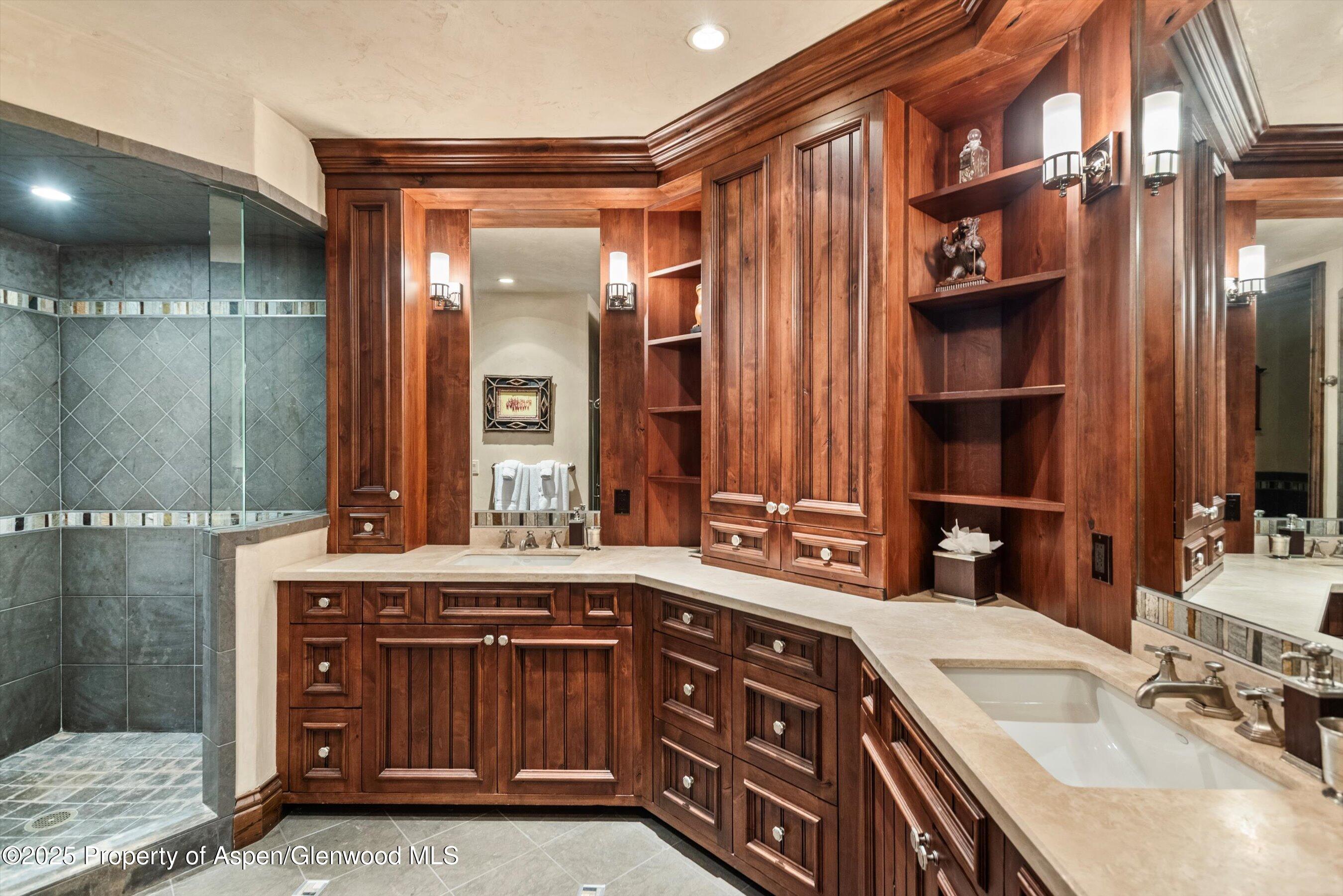 1777 Wood Road Snowmass Village, CO 81615 - Photo 18 of 27 a bathroom with a sink double vanity and a mirror