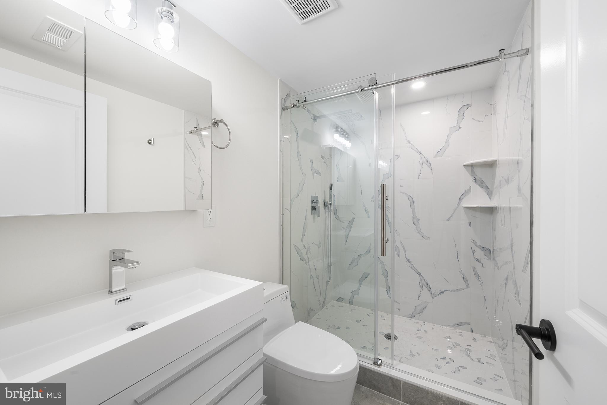 2340 Alter Street Philadelphia, PA 19146 - Photo 38 of 46 a bathroom with a sink toilet and shower