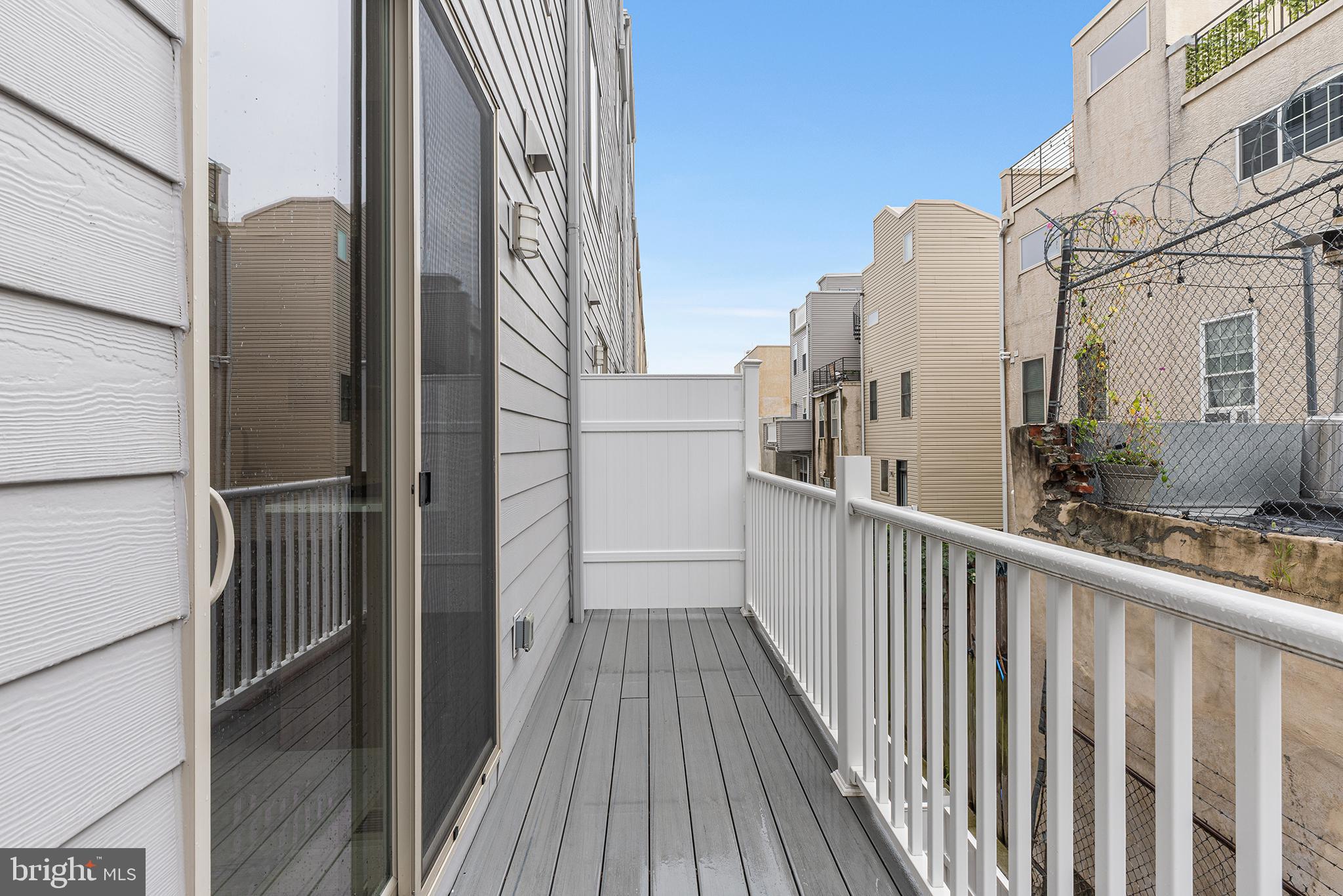 2340 Alter Street Philadelphia, PA 19146 - Photo 7 of 46 a view of a balcony with wooden floor