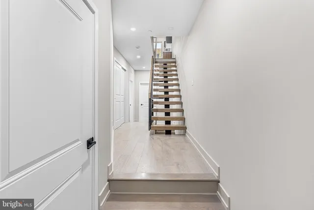 a view of entryway with wooden floor