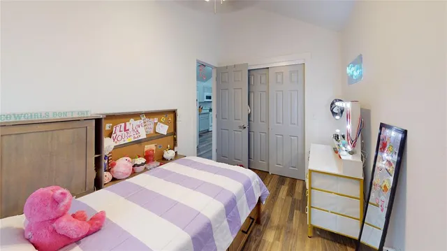 a bedroom with a bed and a closet