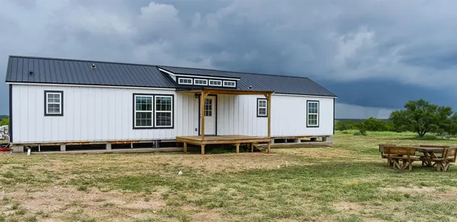a house with trees in the background