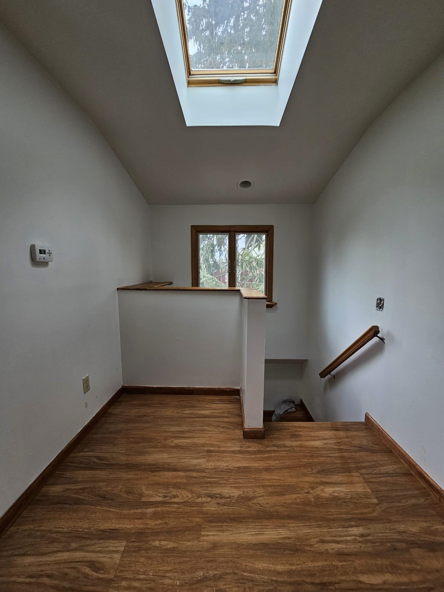 482 Sterling Place, Unit 2 Ridgewood, NJ 07450 - Photo 11 of 15 a view of an empty room with wooden floor and a window