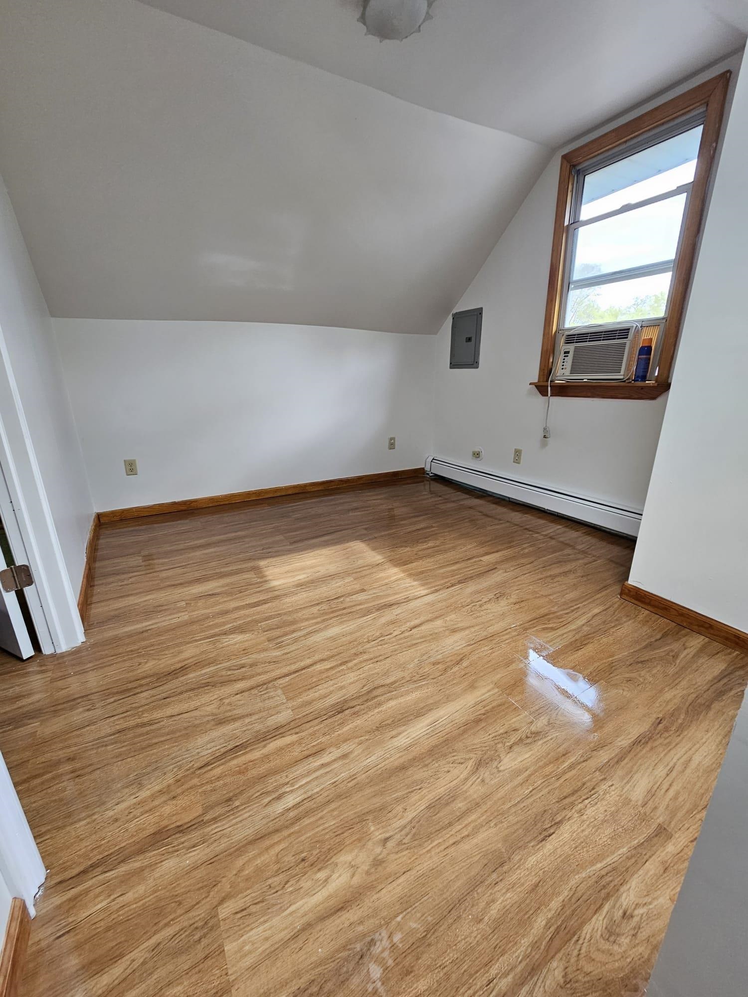 482 Sterling Place, Unit 2 Ridgewood, NJ 07450 - Photo 12 of 15 a view of a room with wooden floor and window
