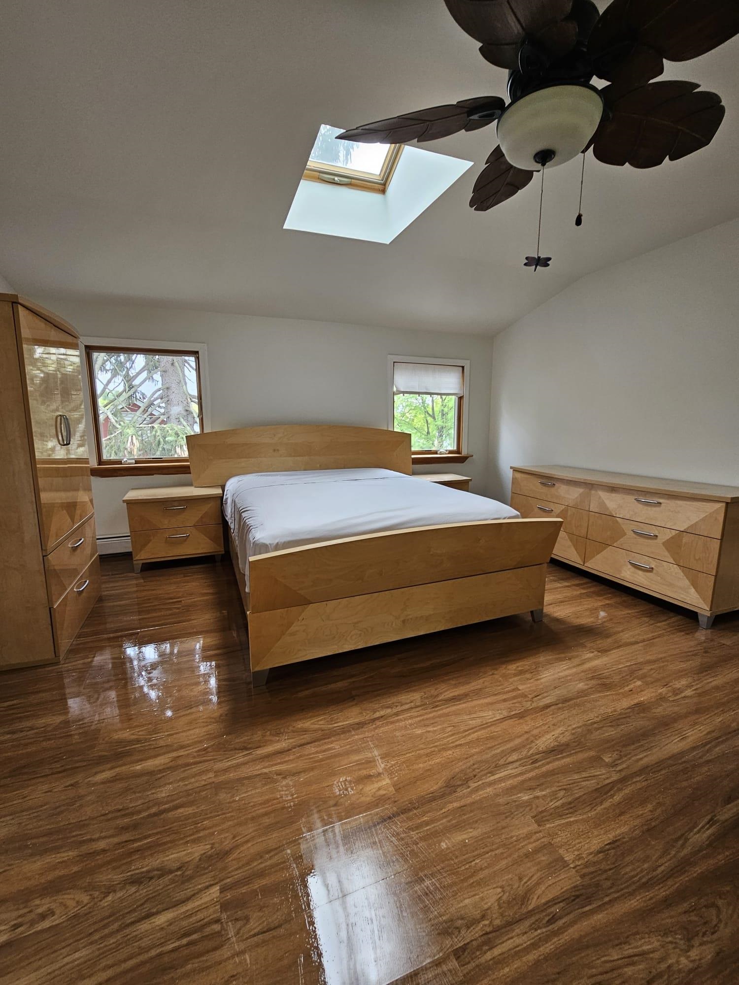 482 Sterling Place, Unit 2 Ridgewood, NJ 07450 - Photo 13 of 15 a spacious bedroom with a bed and wooden floor