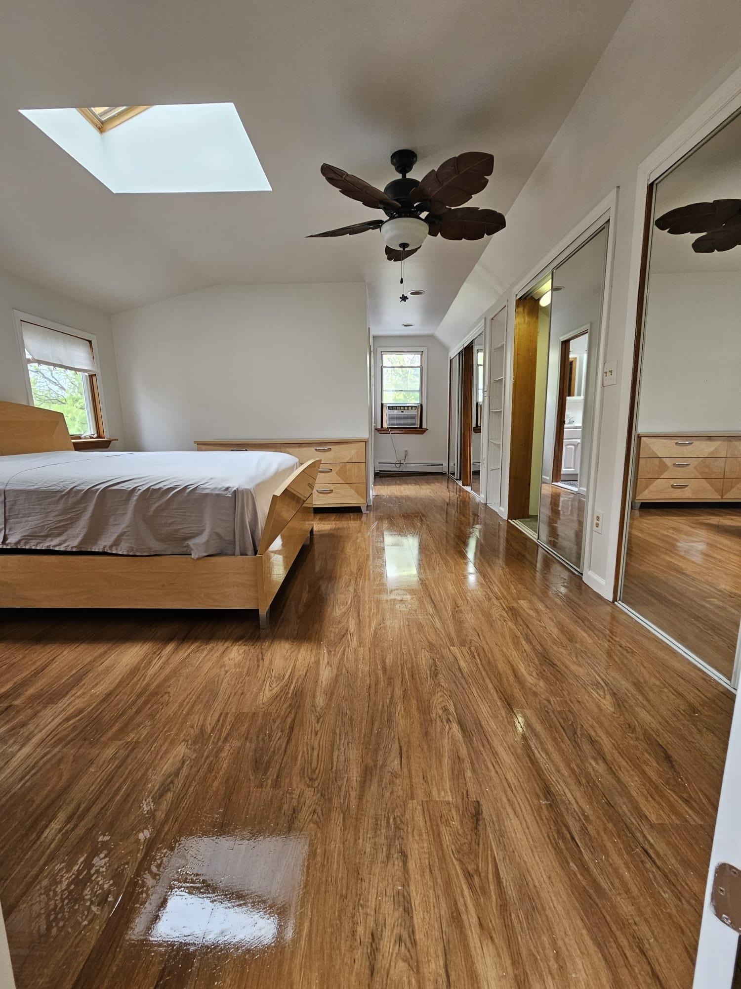 482 Sterling Place, Unit 2 Ridgewood, NJ 07450 - Photo 14 of 15 a spacious bedroom with a bed and a large window