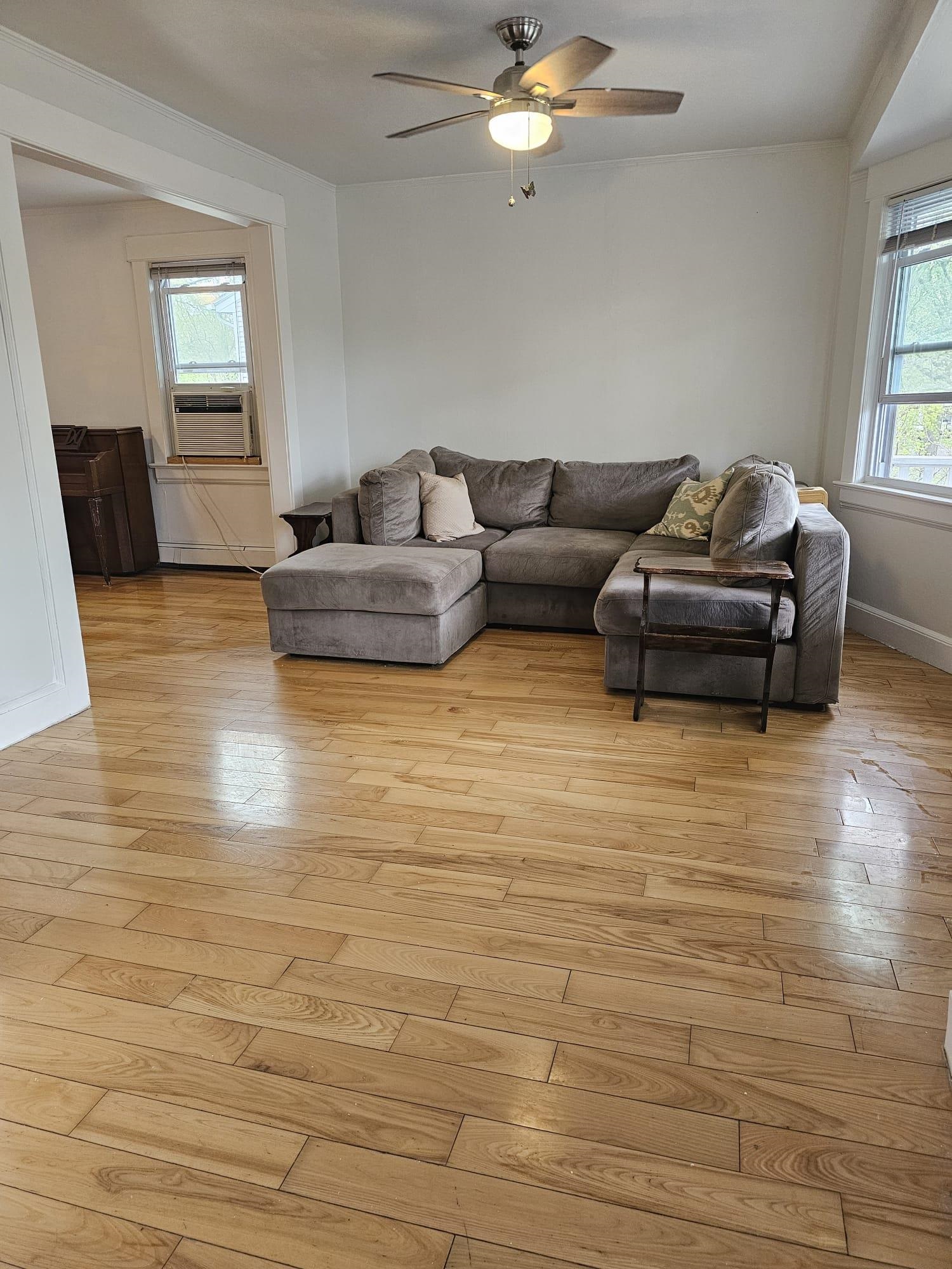 482 Sterling Place, Unit 2 Ridgewood, NJ 07450 - Photo 2 of 15 a living room with furniture and a chandelier