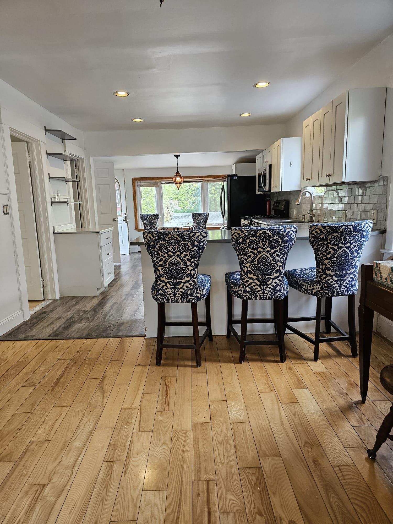 482 Sterling Place, Unit 2 Ridgewood, NJ 07450 - Photo 7 of 15 a view of a dining room with furniture and wooden floor