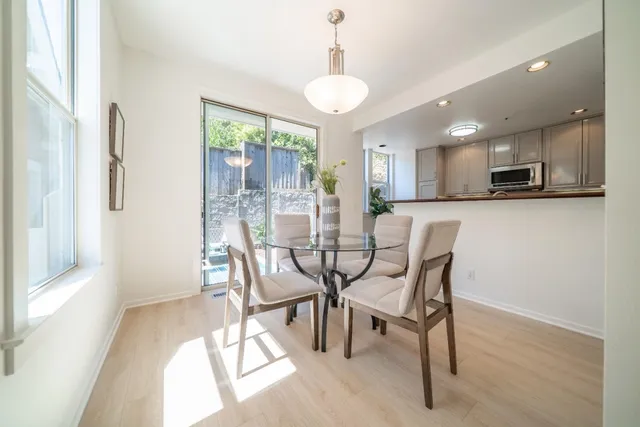 a dining room with furniture and window
