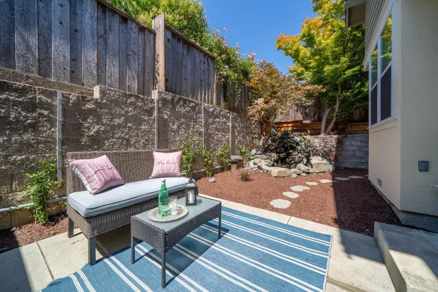 a outdoor living space with furniture and a potted plant