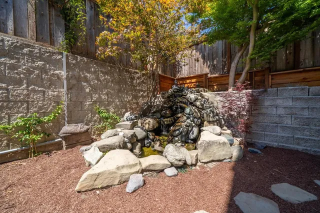 a view of a backyard of the house