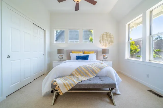 a bedroom with a bed and window