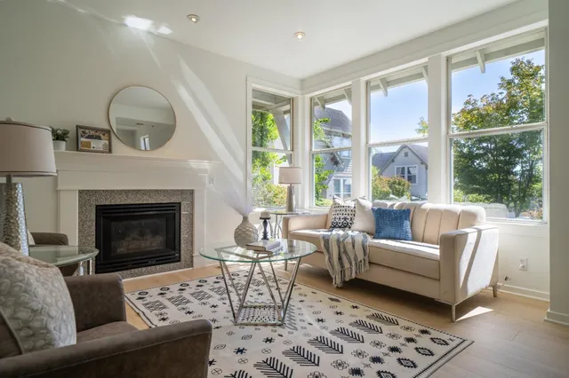 a living room with furniture and a fireplace