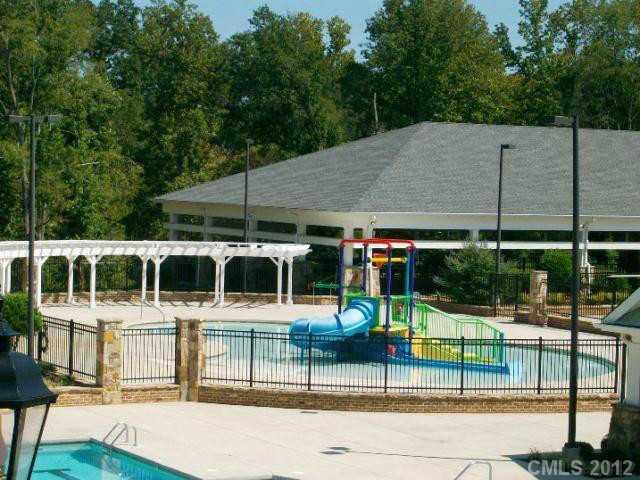 2001 Fallondale Road, Unit MB 919 Waxhaw, NC 28173 - Photo 8 of 11 a view of a swimming pool with a patio