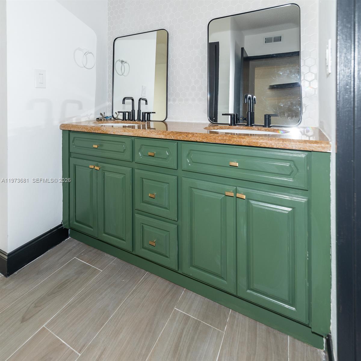 9225 Collins Avenue, Unit 1010 Surfside, FL 33154 - Photo 14 of 25 a view of two mirror and a sink