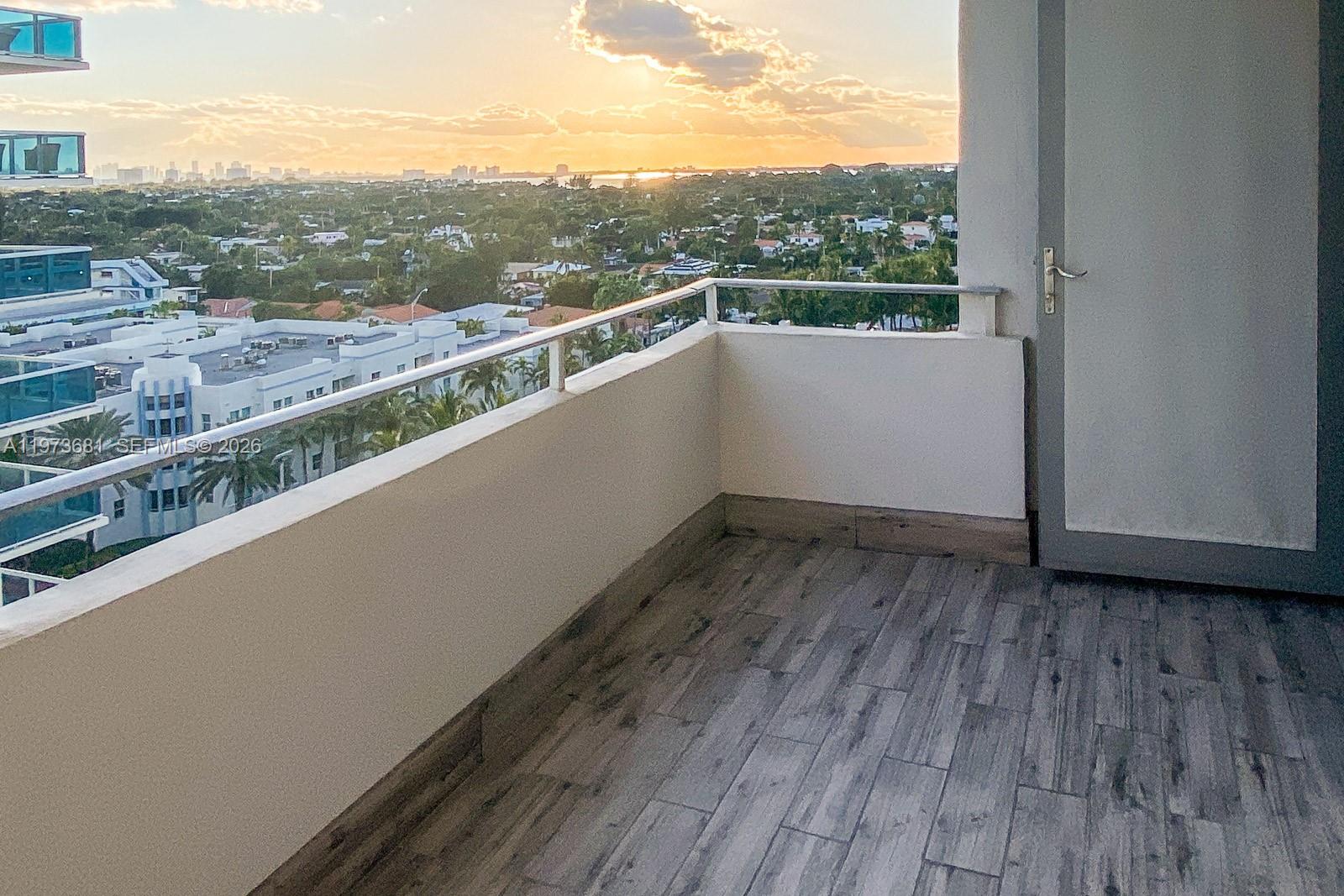 9225 Collins Avenue, Unit 1010 Surfside, FL 33154 - Photo 6 of 25 a view of a balcony with wooden floor