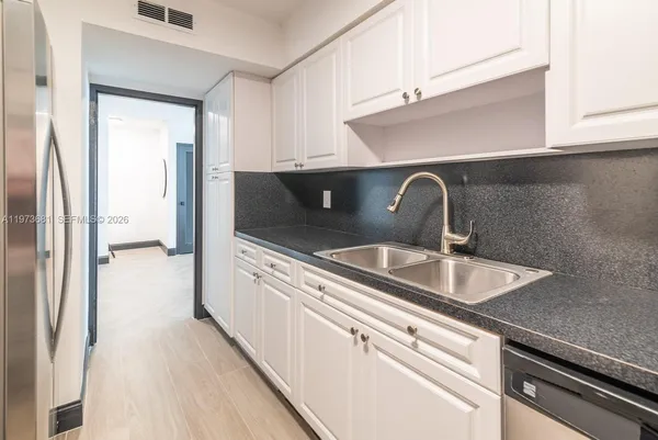 a kitchen with a stove and a microwave