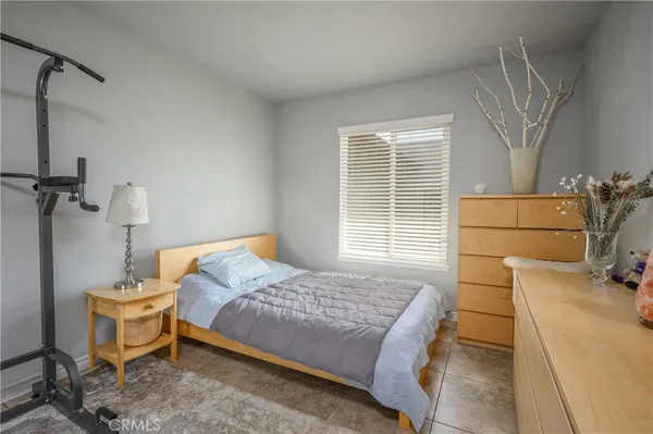 a bedroom with a bed and a table in it