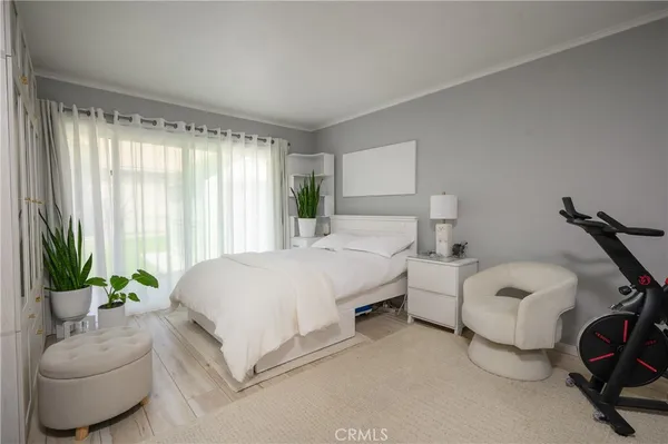 a bedroom with bed and a couch