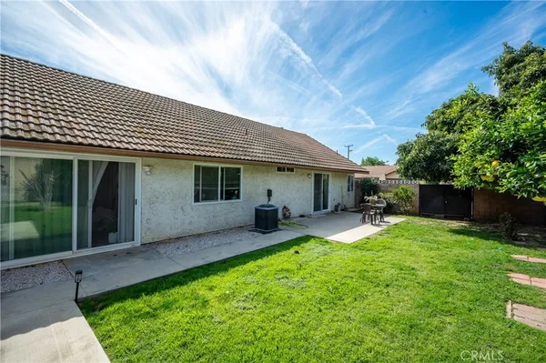 a view of a house with a yard porch and sitting area