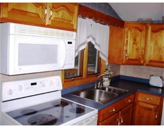 2001 Overlook Drive Three Rivers, MA 01080 - Photo 6 of 25 a kitchen with stainless steel appliances granite countertop a sink and a microwave oven