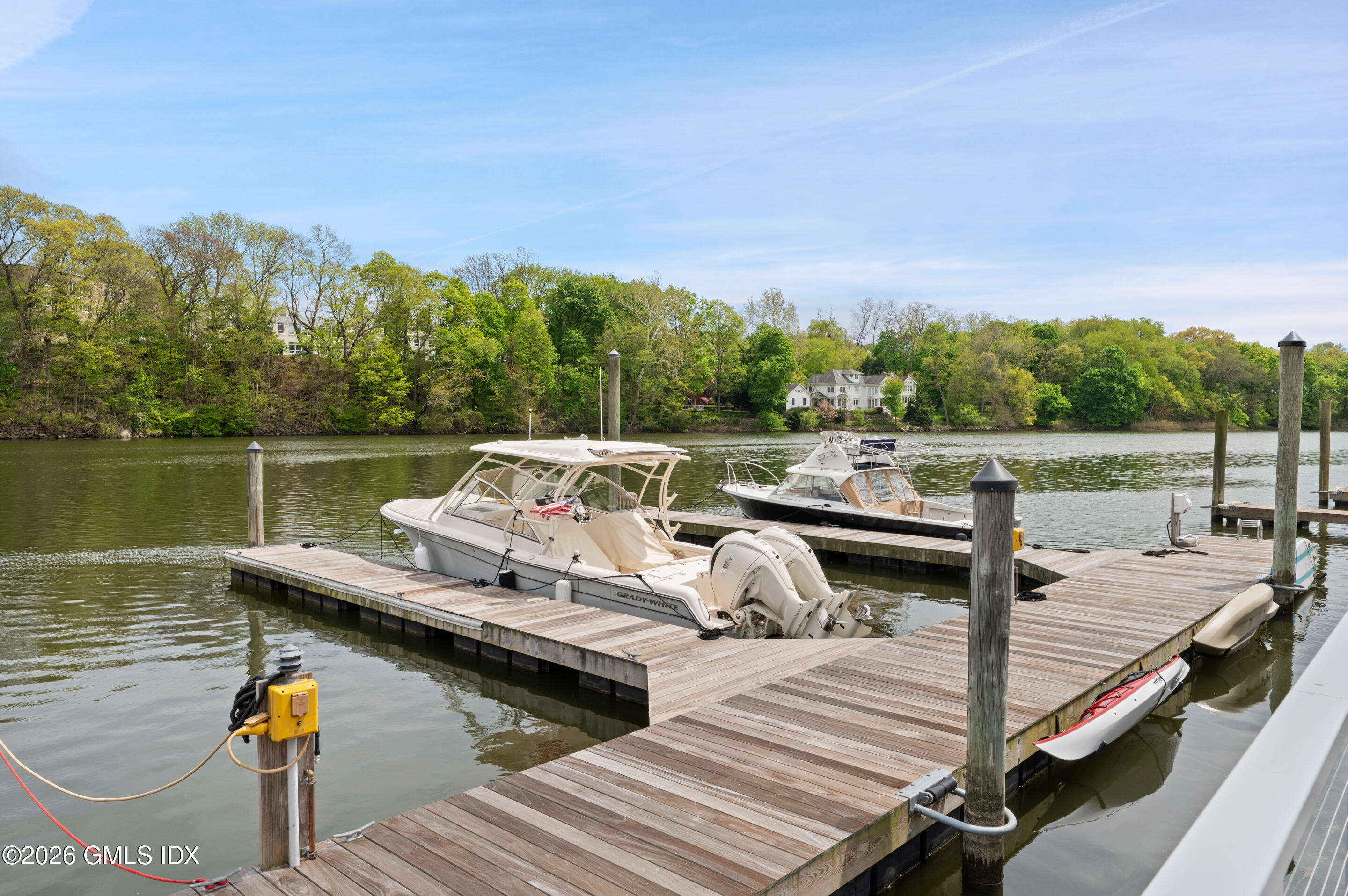 115 River Road, Unit 3 Cos Cob, CT 06807 - Photo 4 of 40 a view of a terrace with couches and wooden floor