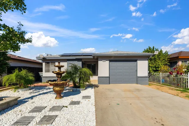 a front view of a house with a patio