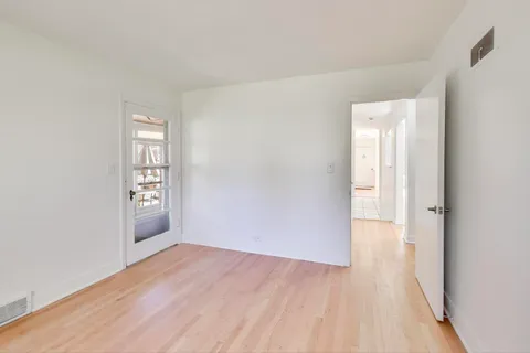 a view of an empty room and window